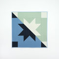 Quilt with geometric pattern on a white background