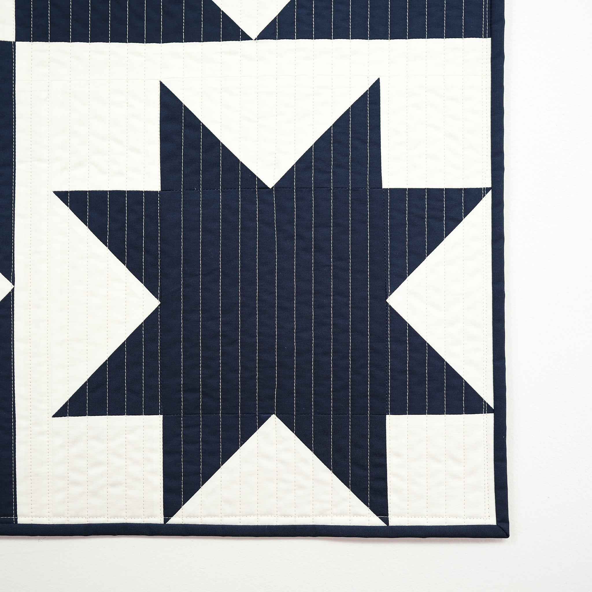Navy blue star pattern on a white background